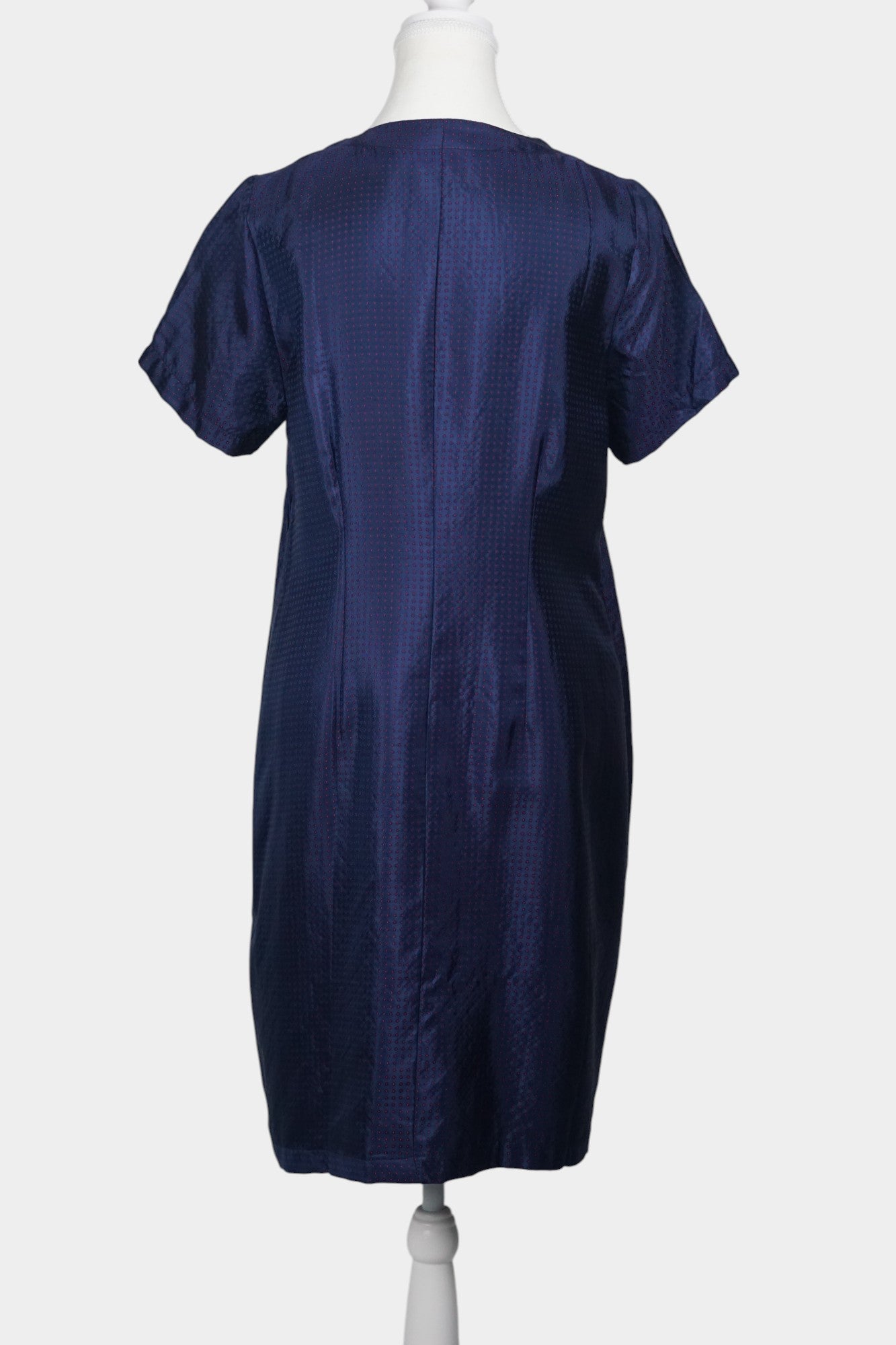 Navy blue Song Brocade silk dress featuring subtle red dotted pattern and ornamental buttons.