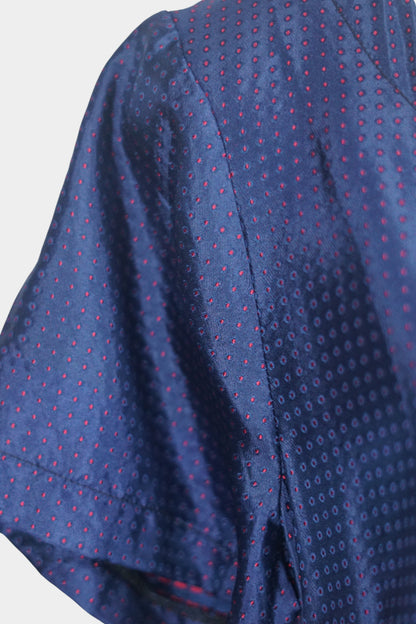 Navy blue Song Brocade silk dress featuring subtle red dotted pattern and ornamental buttons.