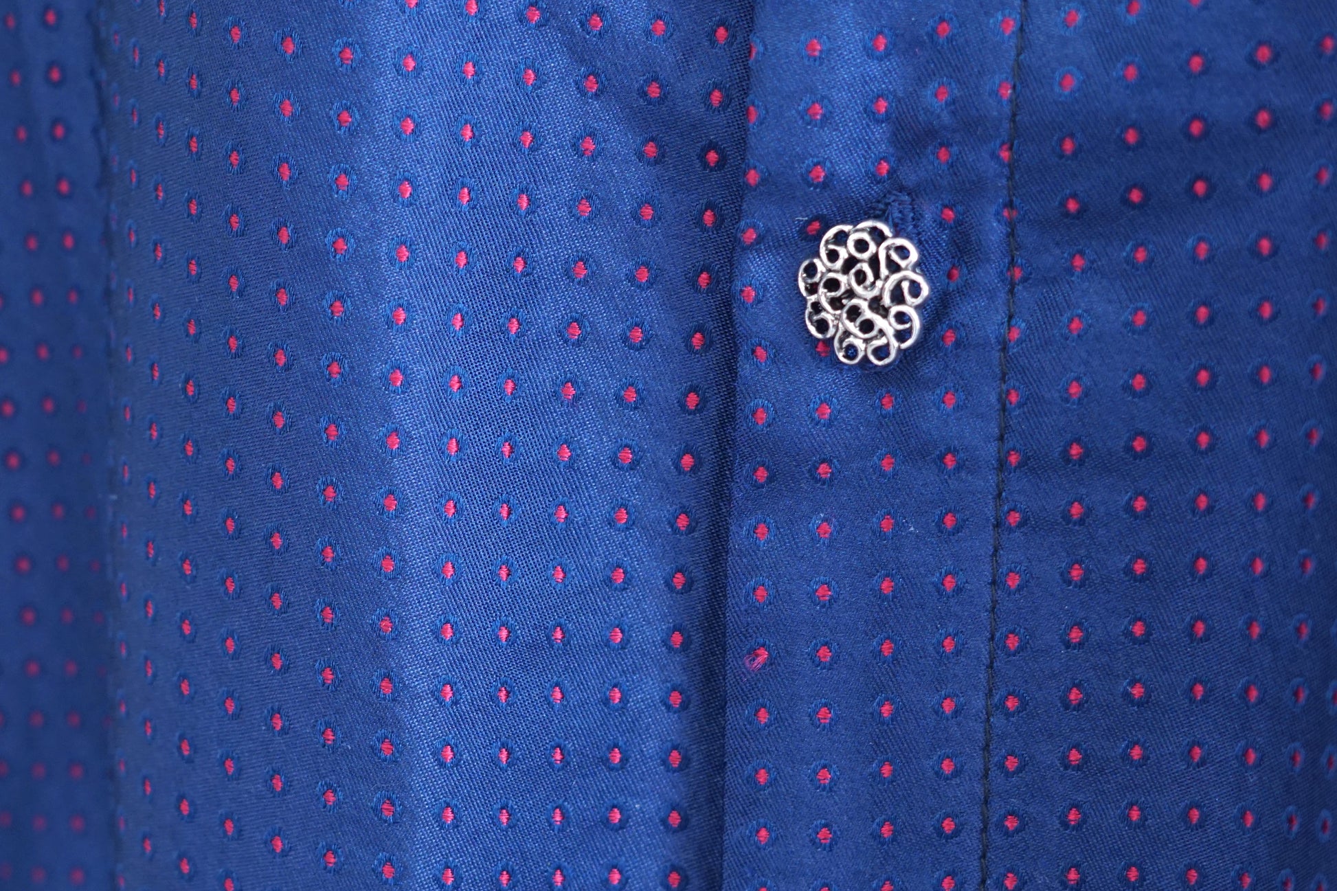 Navy blue Song Brocade silk dress featuring subtle red dotted pattern and ornamental buttons.