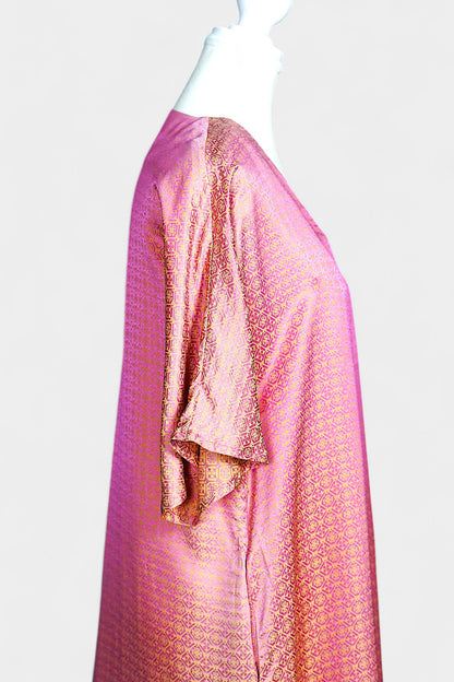 Women's pink and gold Song Brocade dress with a geometric lattice pattern and V-neckline on a mannequin