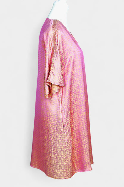 Women's pink and gold Song Brocade dress with a geometric lattice pattern and V-neckline on a mannequin