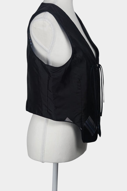 Black Song Brocade vest with V-neck, front tie closure, and white geometric hem details