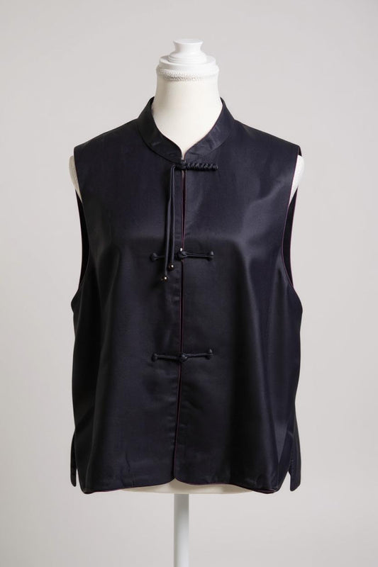 Women's dark purple Song Brocade vest with a mandarin collar, purple piping, and traditional frog buttons with tassels.