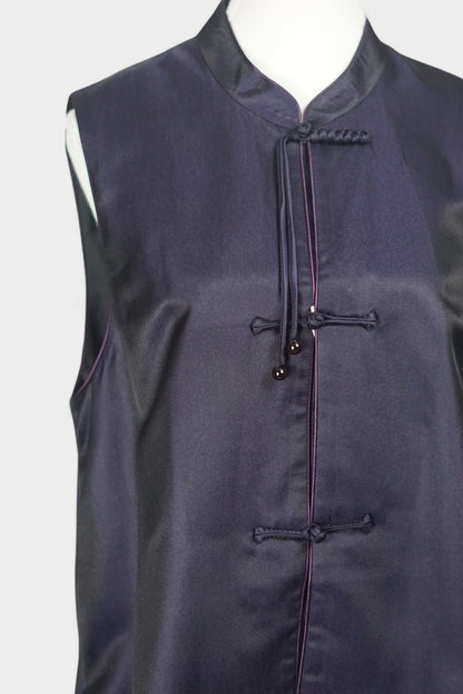 Women's dark purple Song Brocade vest with a mandarin collar, purple piping, and traditional frog buttons with tassels.