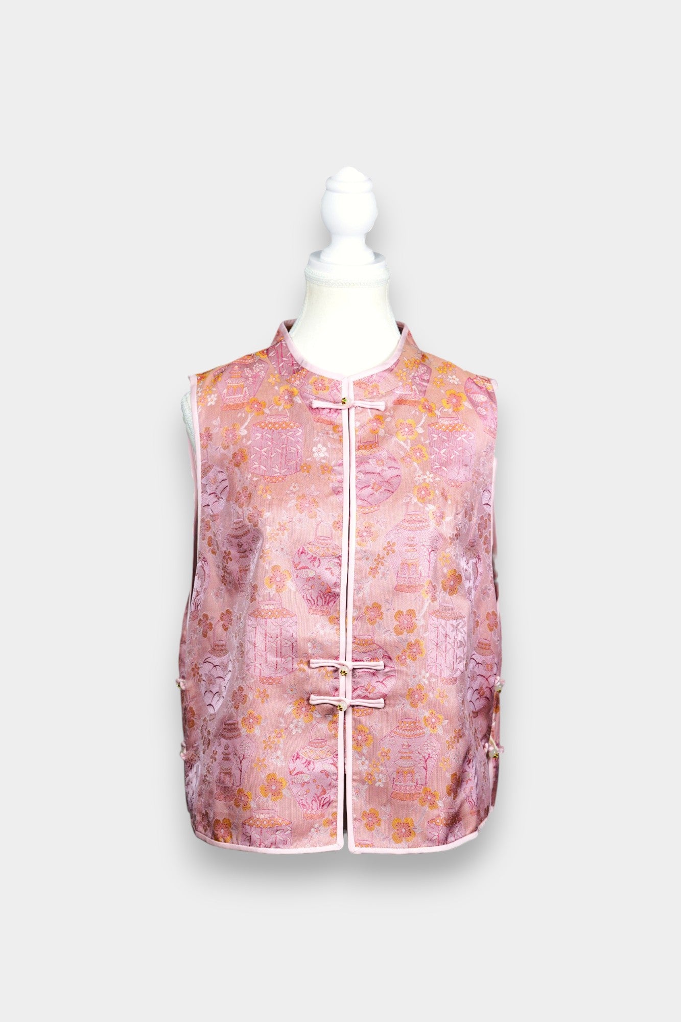 Pink Song Brocade silk vest featuring traditional lantern motifs and mandarin collar.