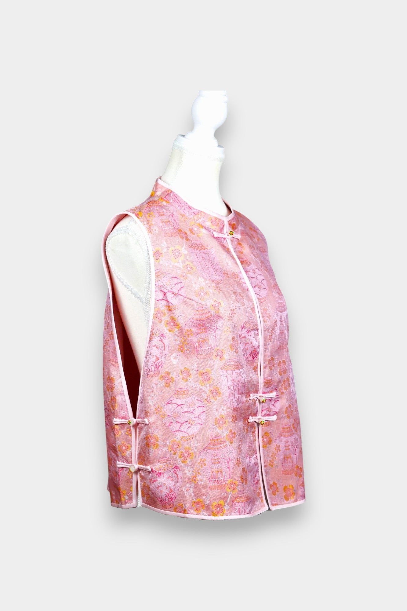 Pink Song Brocade silk vest featuring traditional lantern motifs and mandarin collar.