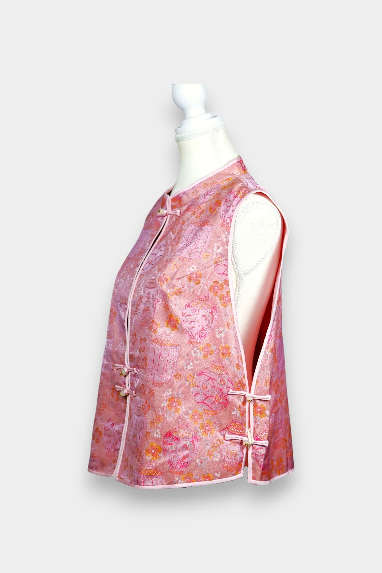 Pink Song Brocade silk vest featuring traditional lantern motifs and mandarin collar.