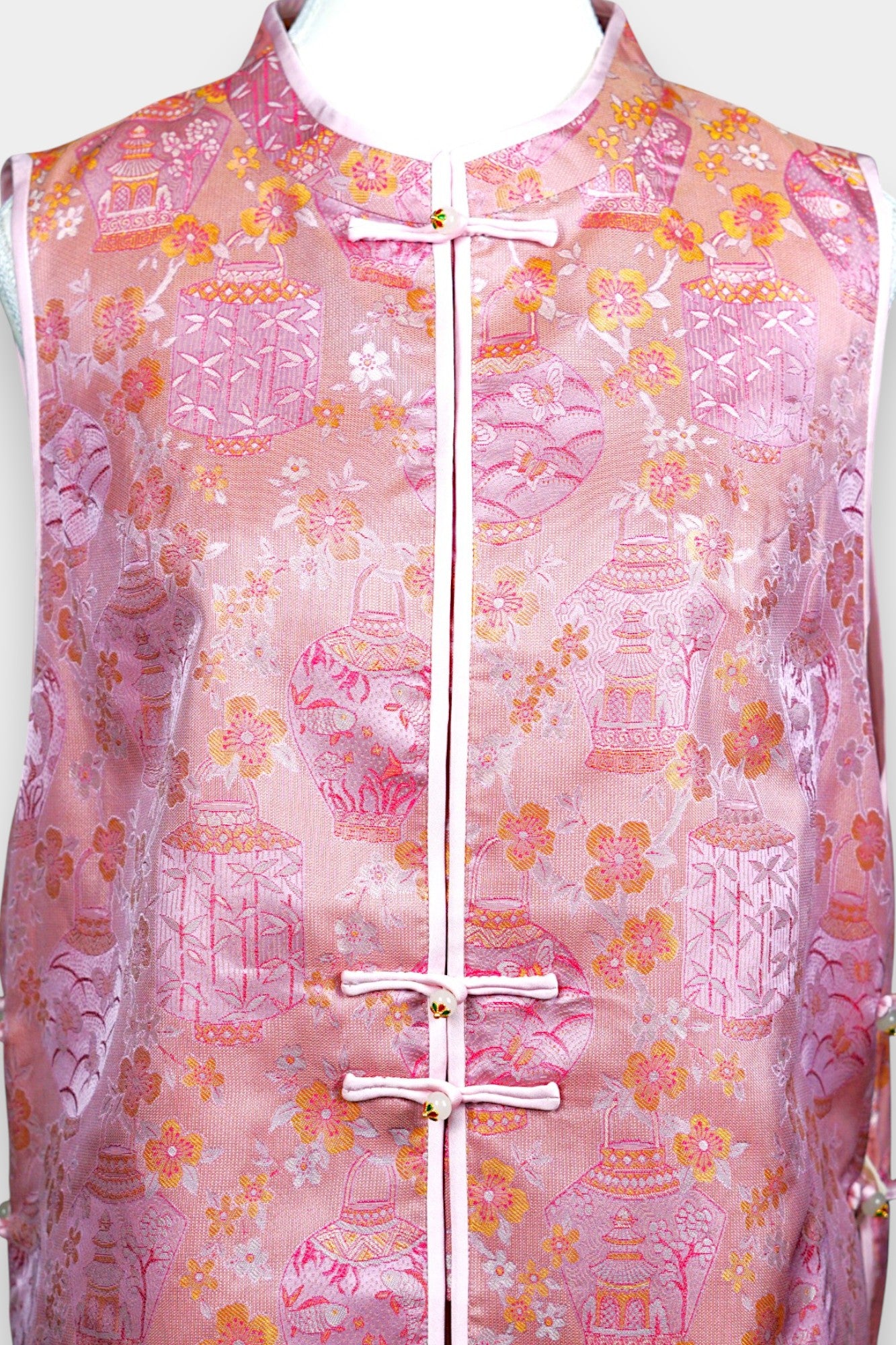 Pink Song Brocade silk vest featuring traditional lantern motifs and mandarin collar.