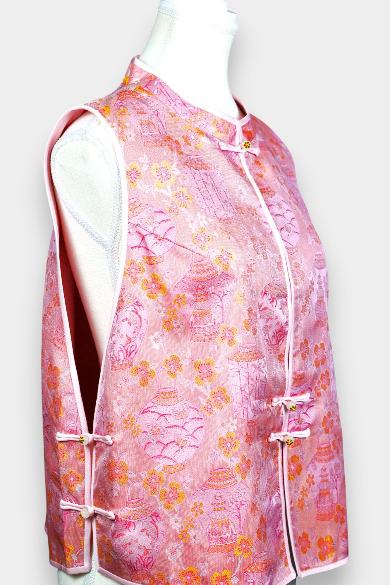 Pink Song Brocade silk vest featuring traditional lantern motifs and mandarin collar.