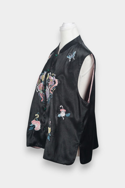 Traditional mandarin collar vest in black silk, adorned with pastel embroidered motifs of butterflies and mythical creatures