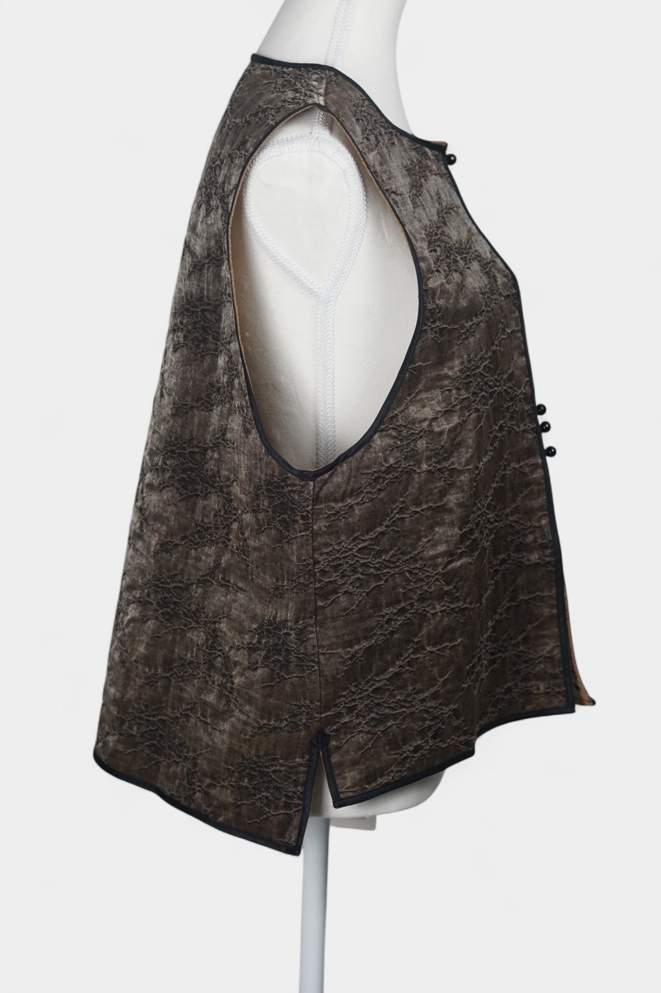 Brown Tussah silk sleeveless top featuring unique crinkled texture and black piping